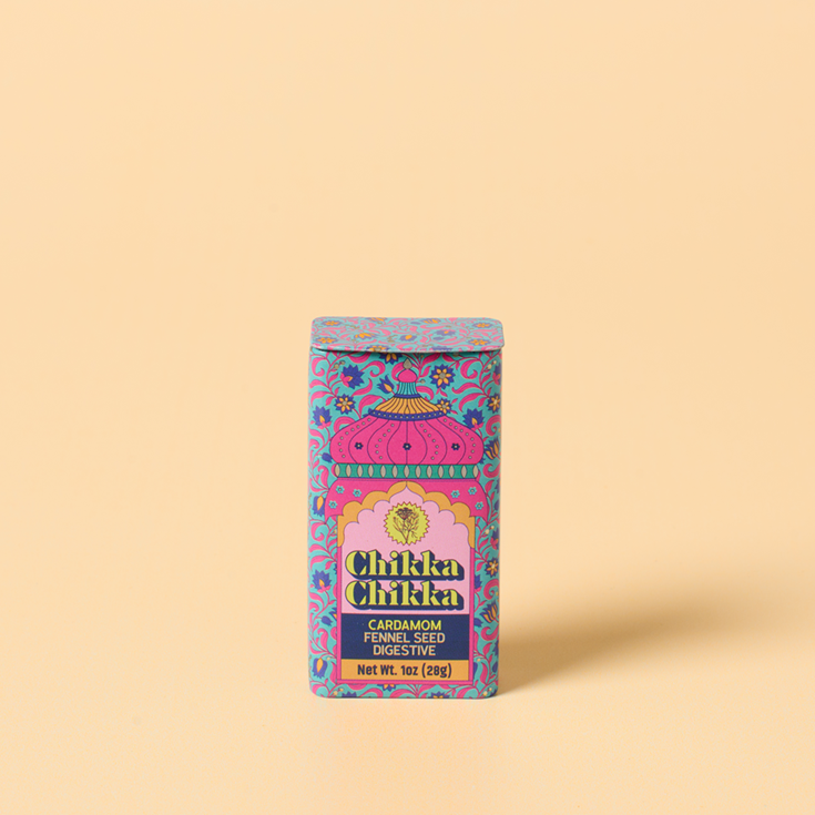 Colorful packaging of Chikka Chikka on a light pink coloredd background