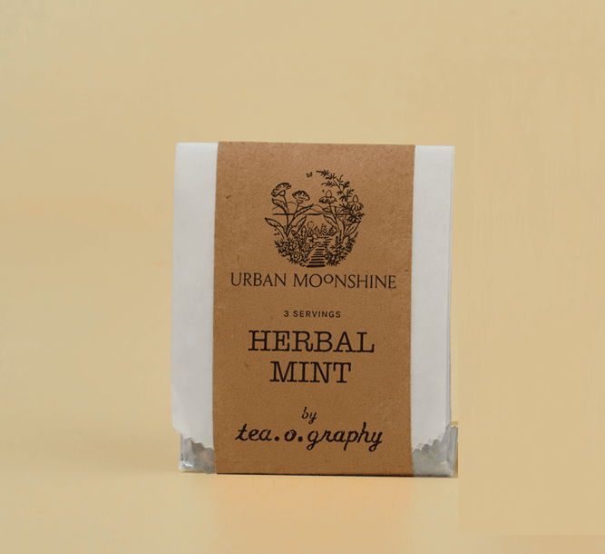 Herbal mint tea package by Urban Moonshine on a beige background