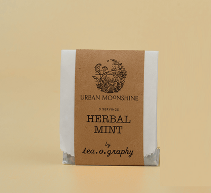 Herbal mint tea package by Urban Moonshine on a beige background