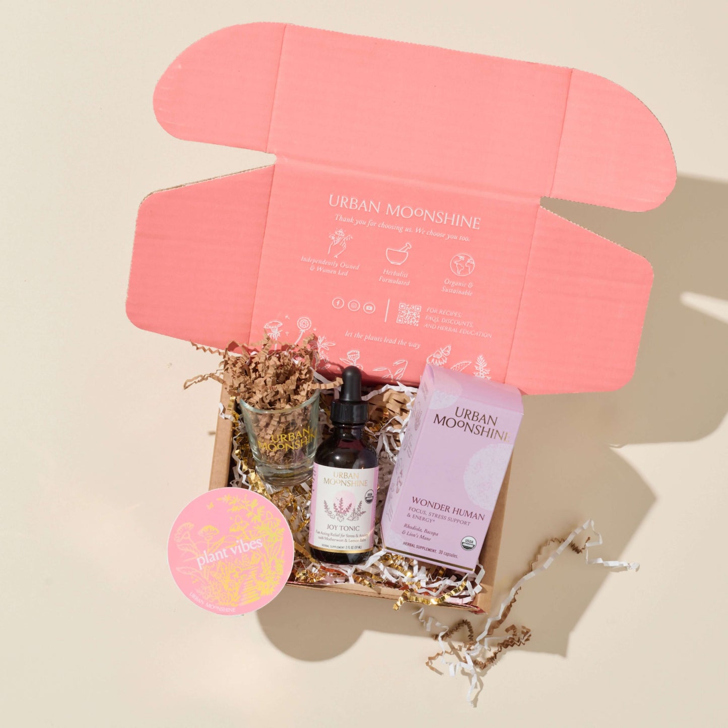 Box of Urban Moonshine products on a beige background