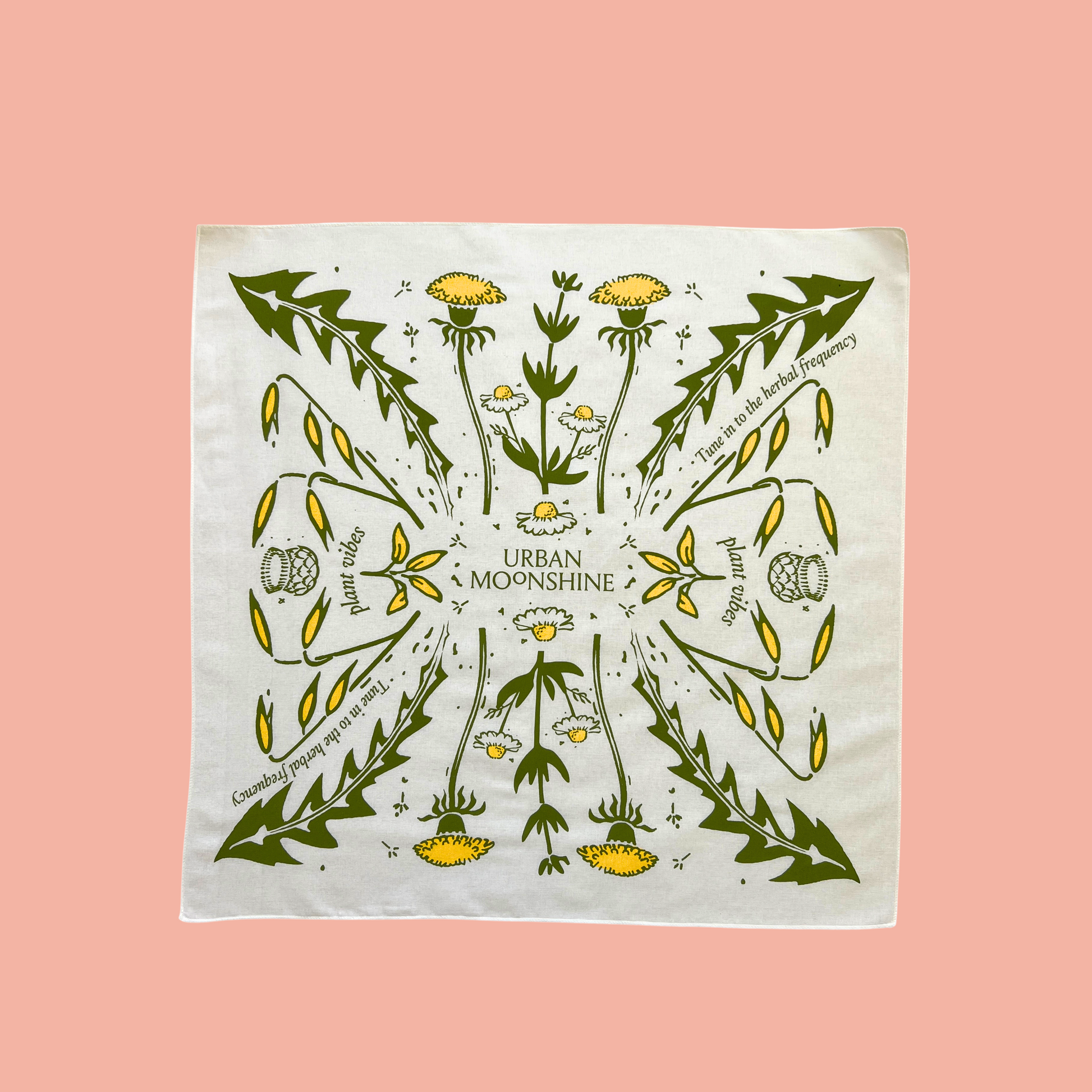 Decorative bandana with plant design and 'Urban Moonshine' text on a pink background