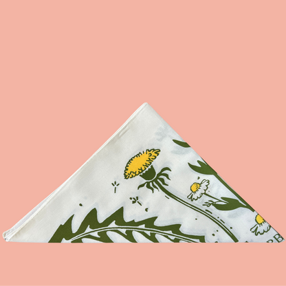 Folded bandana with nature-themed design on a pink background